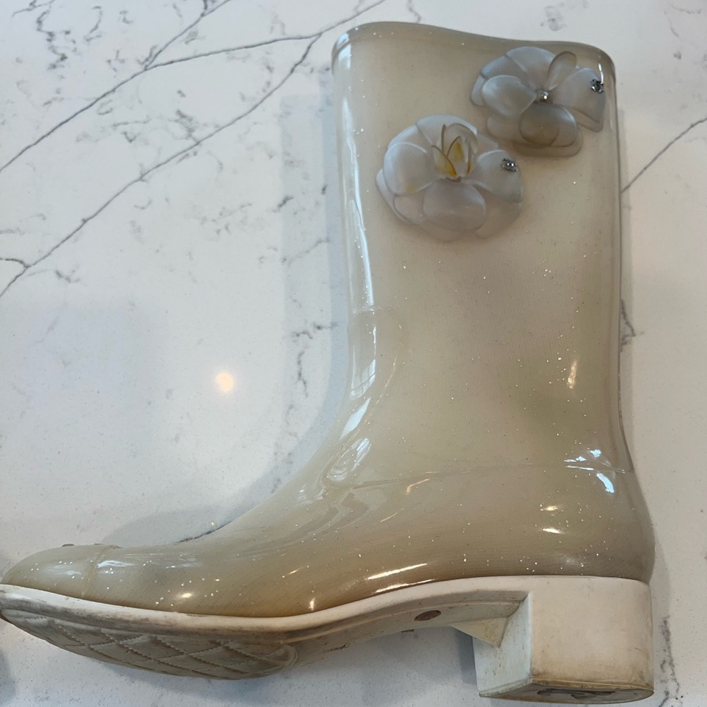 Chanel Elegant Cream Women's Boots with Floral Detail camellia